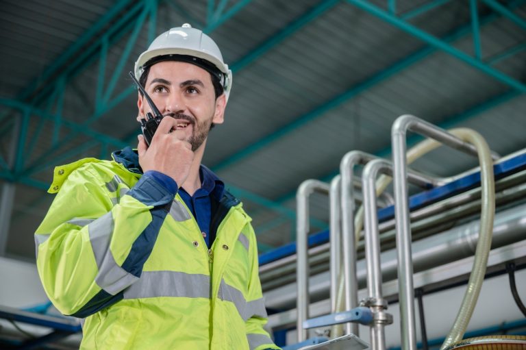 technician engineer working to maintenance a construction equipment industry