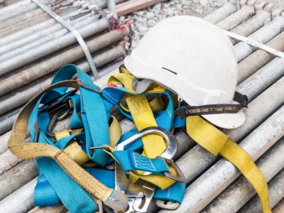Safety helmet and safety harness at a construction site