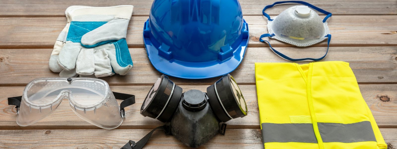 Work safety protection equipment on wooden background. Work safety protection equipment on wooden background.